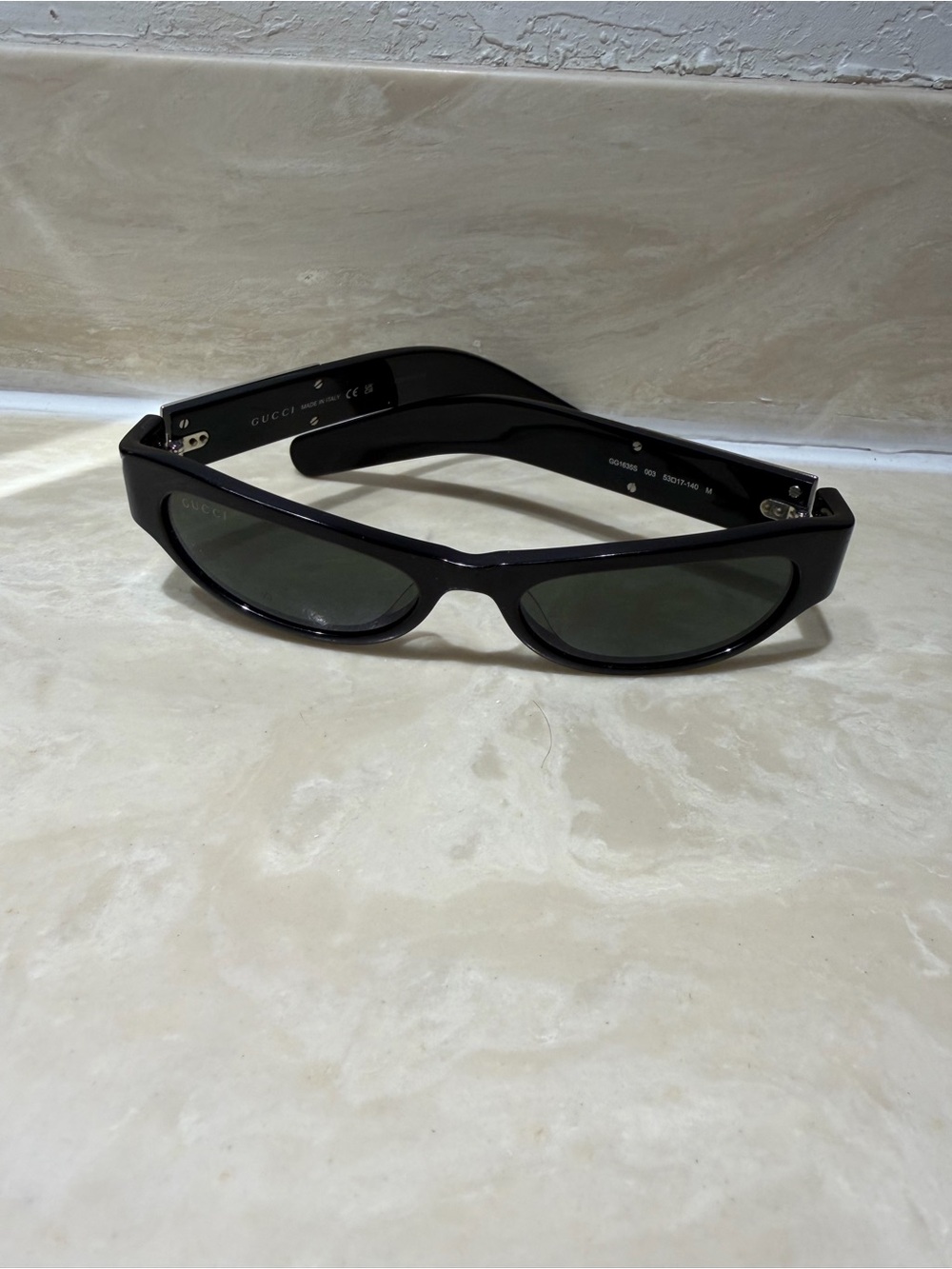 Gucci  women’s Black Frame Sunglasses with Dark Green Lenses